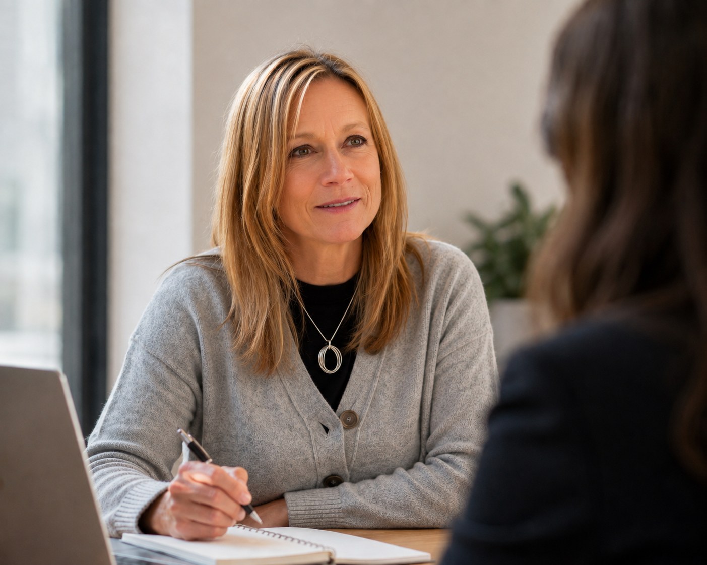 Nicci Marzec in conversation with a client